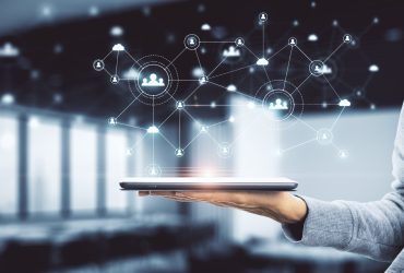 Businessman hand holding tablet with human resource interface and creative social network concept